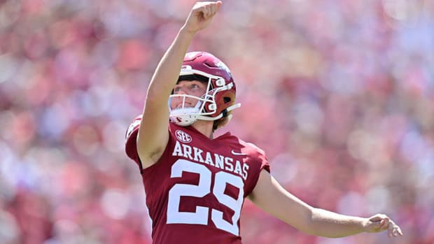 Arkansas kicker Cam Little knocks down an extra point against South Carolina in Razorback Stadium.